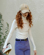 タートルネックデザイントップス